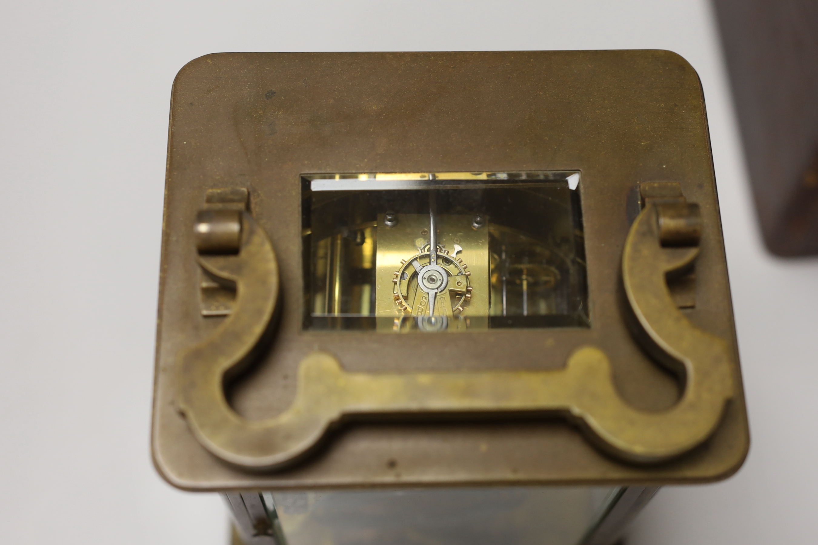 A large 19th century carriage clock with enamel dial and velvet lined leather case, the clock 19cm high